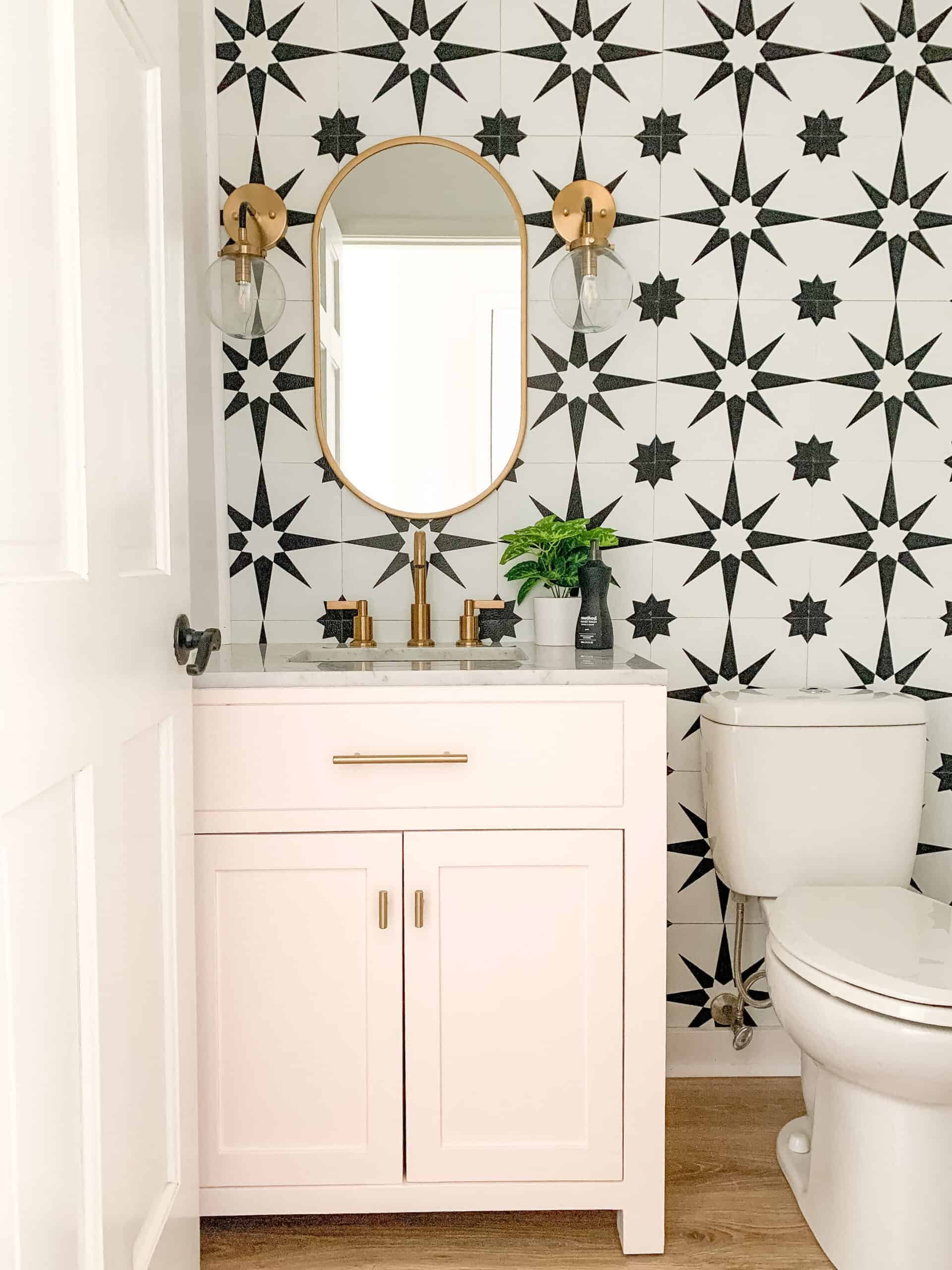 Pink, black and white modern powder room