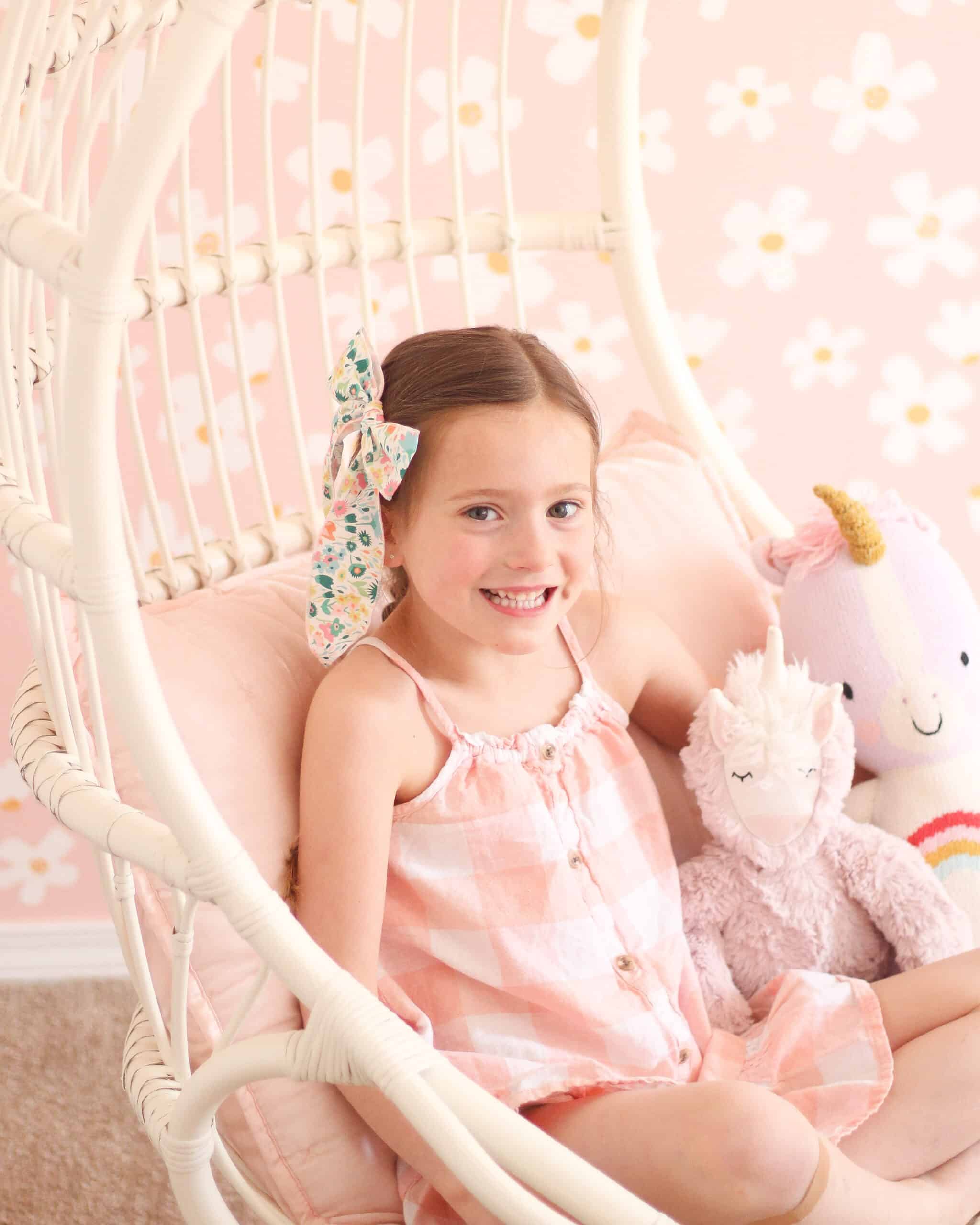 little girl in pink daisy bedroom