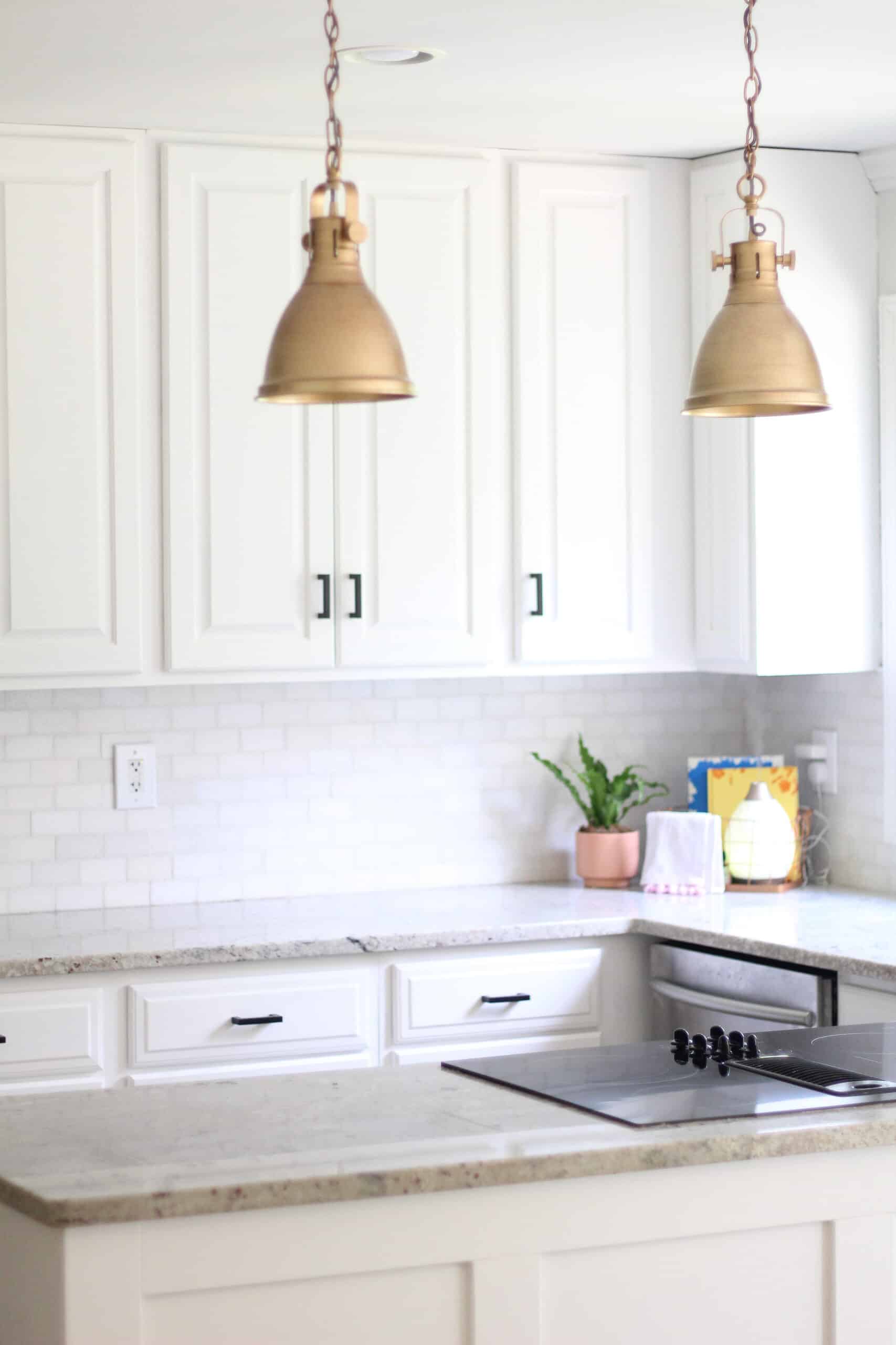 white kitchen with gold and black 