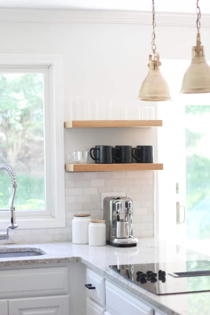 white kitchen with wood shelves