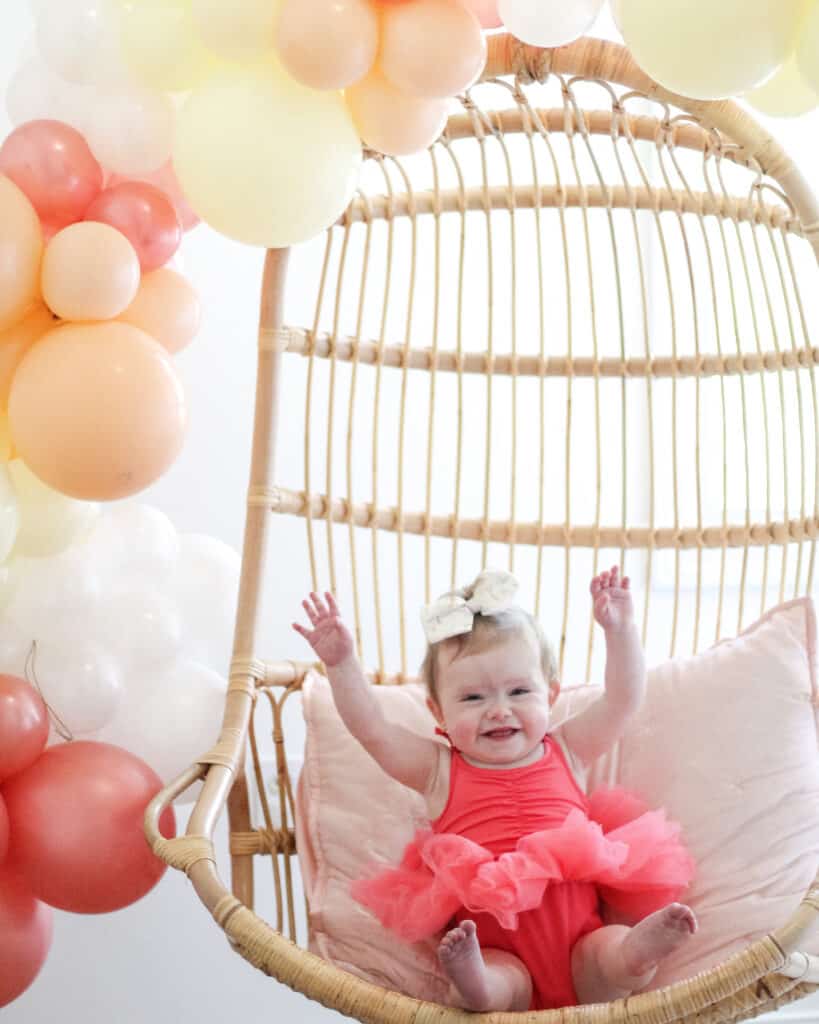 baby girl in Serena and Lilly chair 