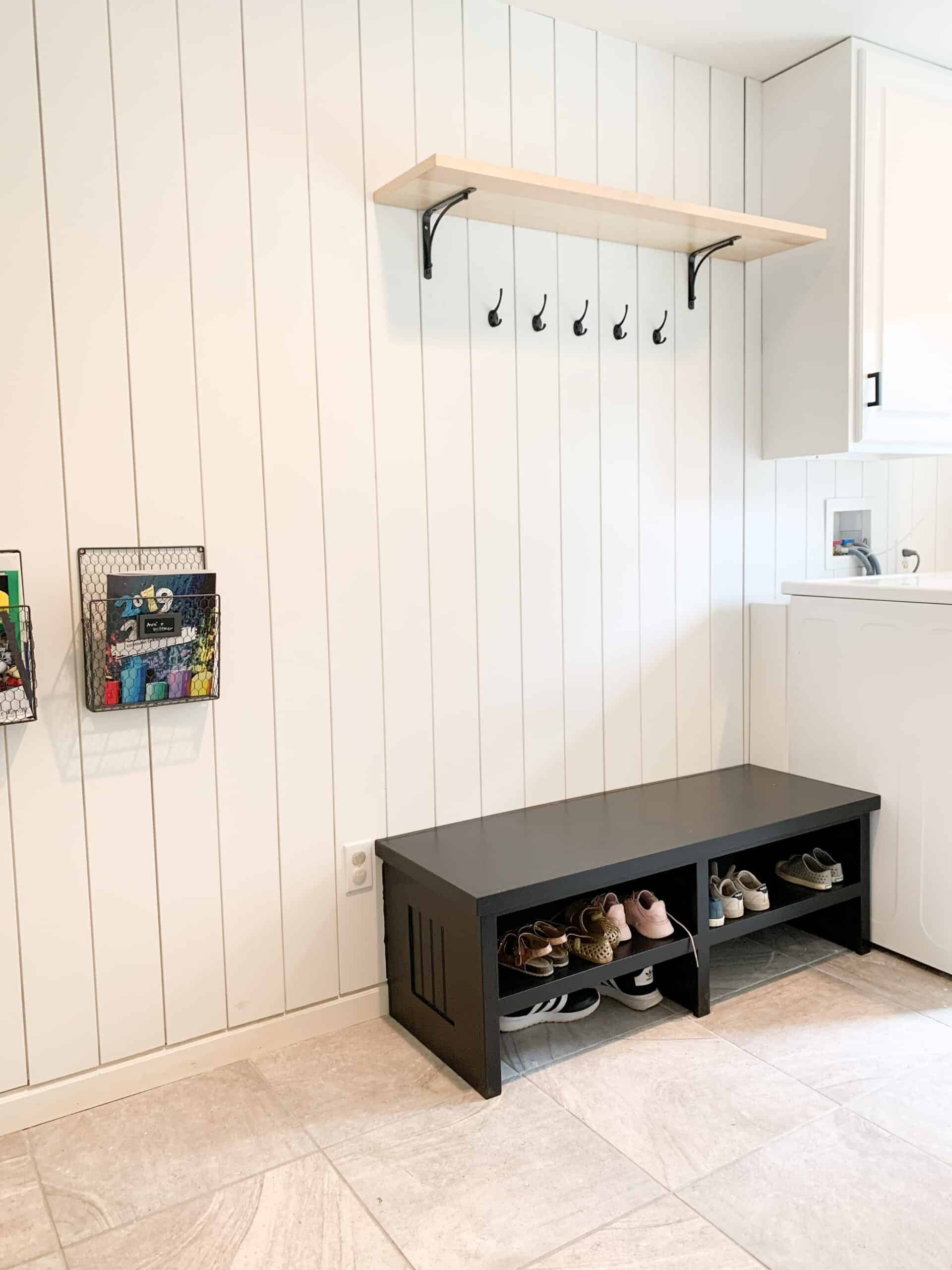 black bench in laundry room
