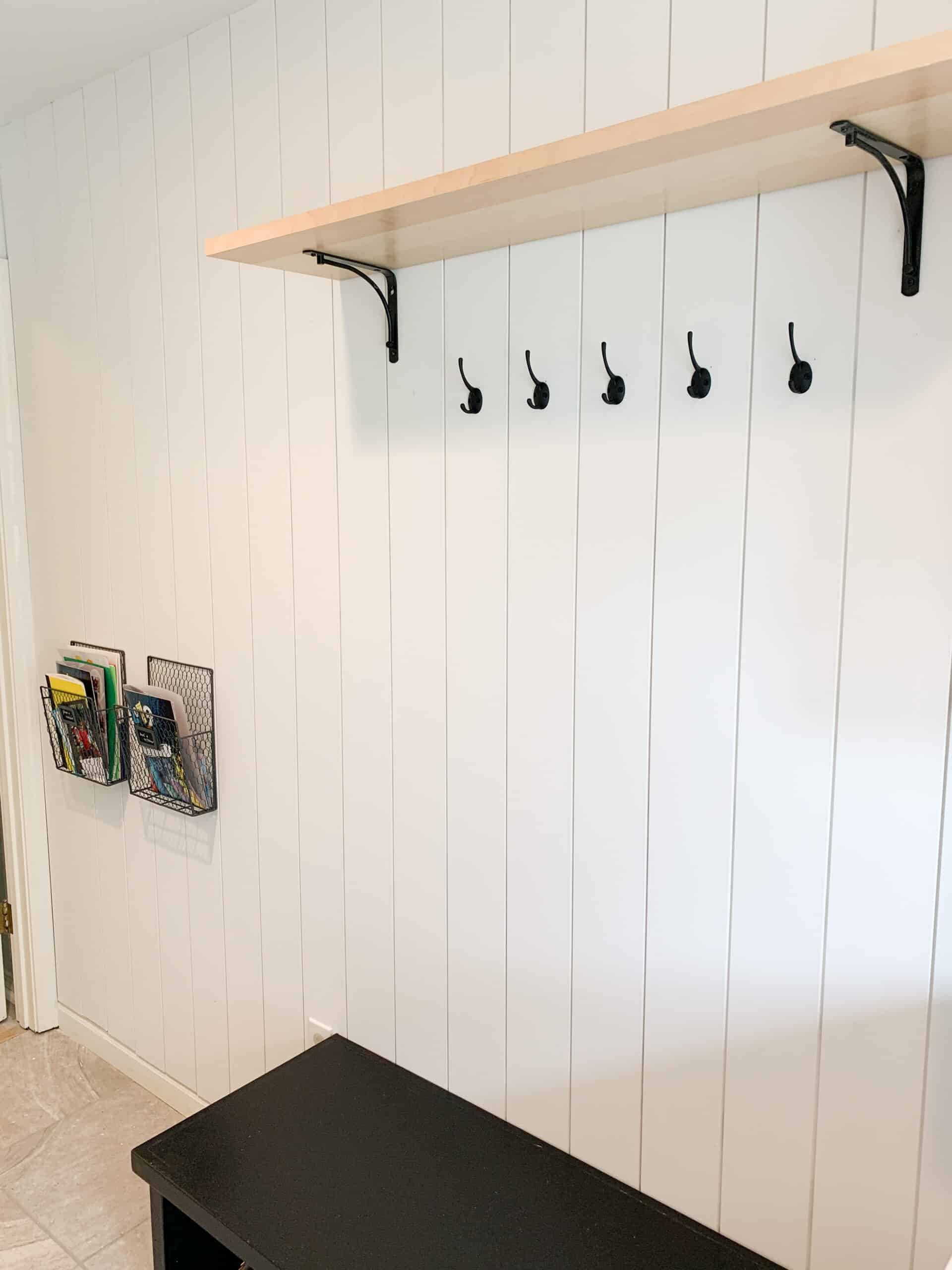 mudroom with vertical shiplap