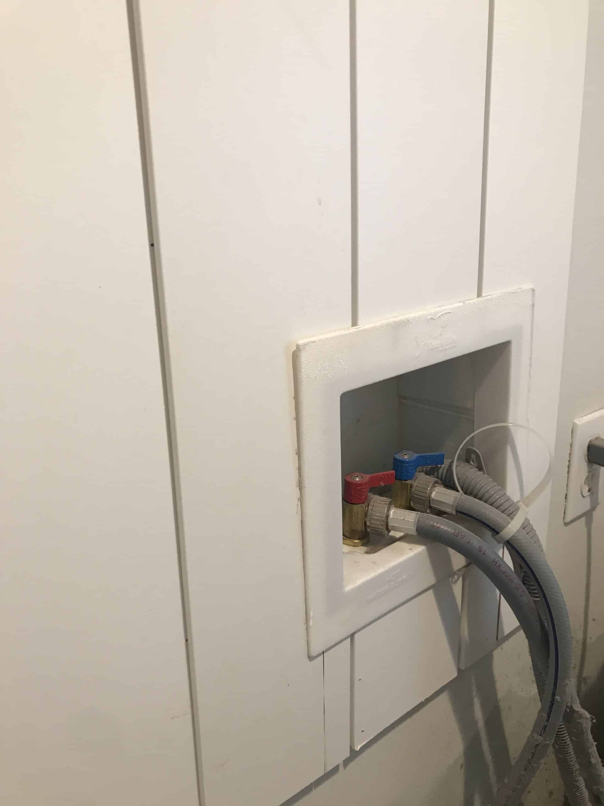 laundry room with vertical shiplap