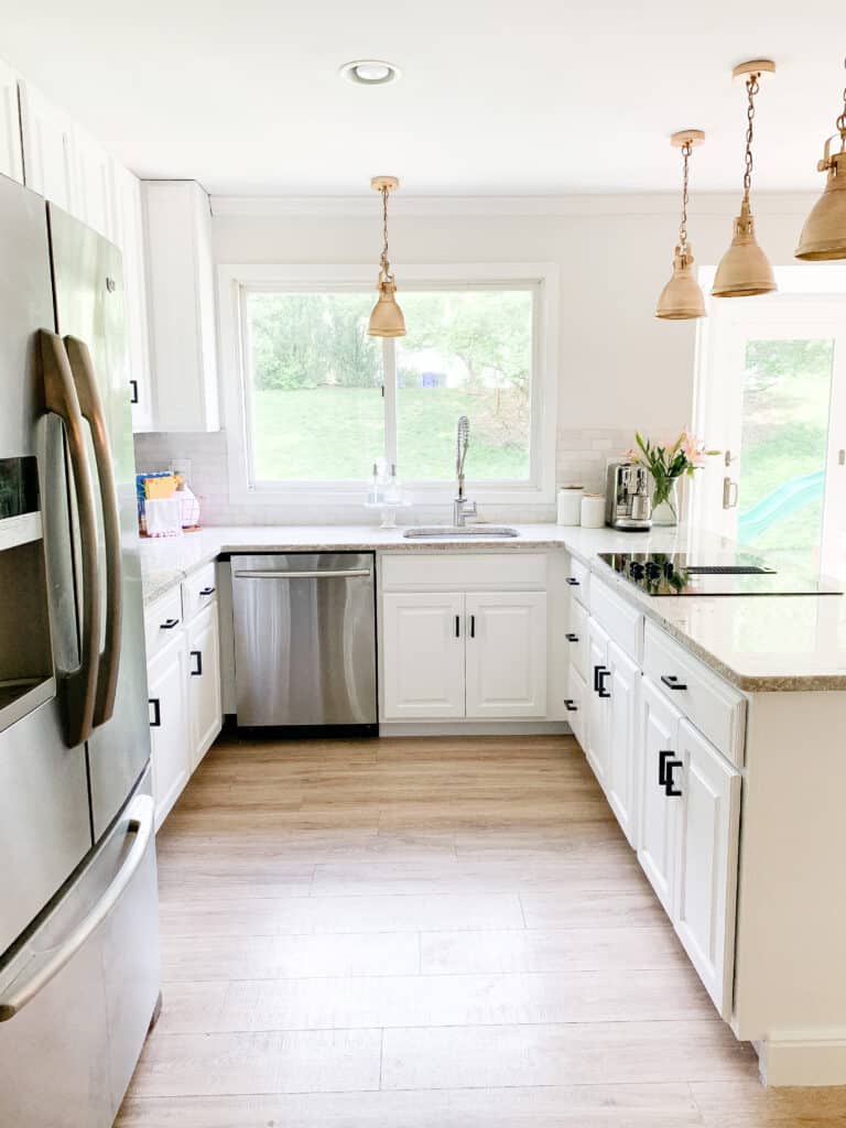 white kitchen cabinets and Pergo Flooring 