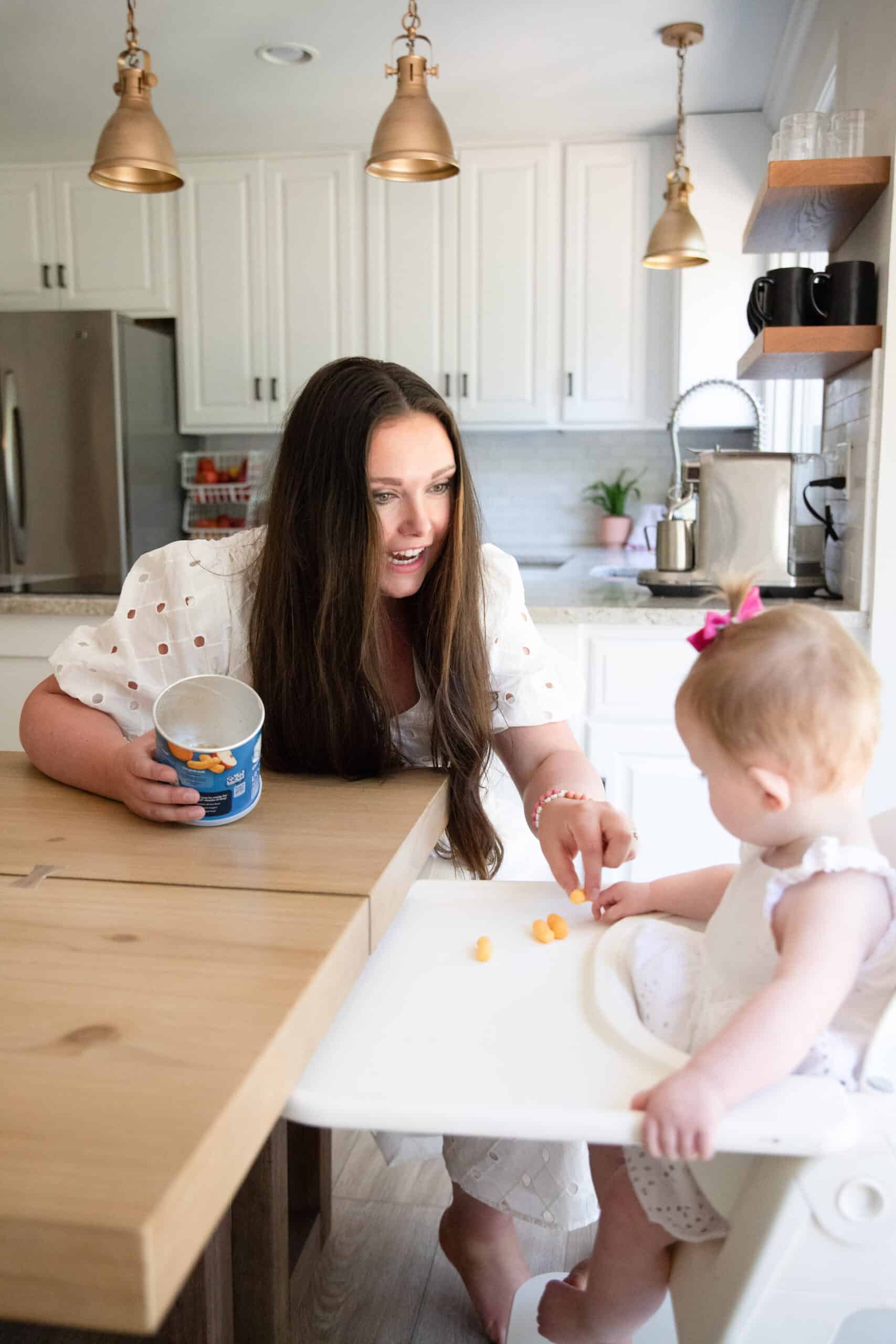 mom feeding toddler