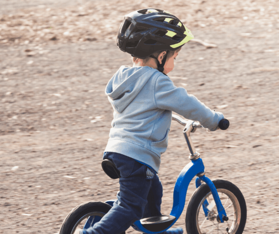 toddler on strider bike