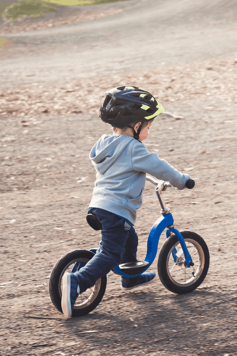 toddler on strider bike 