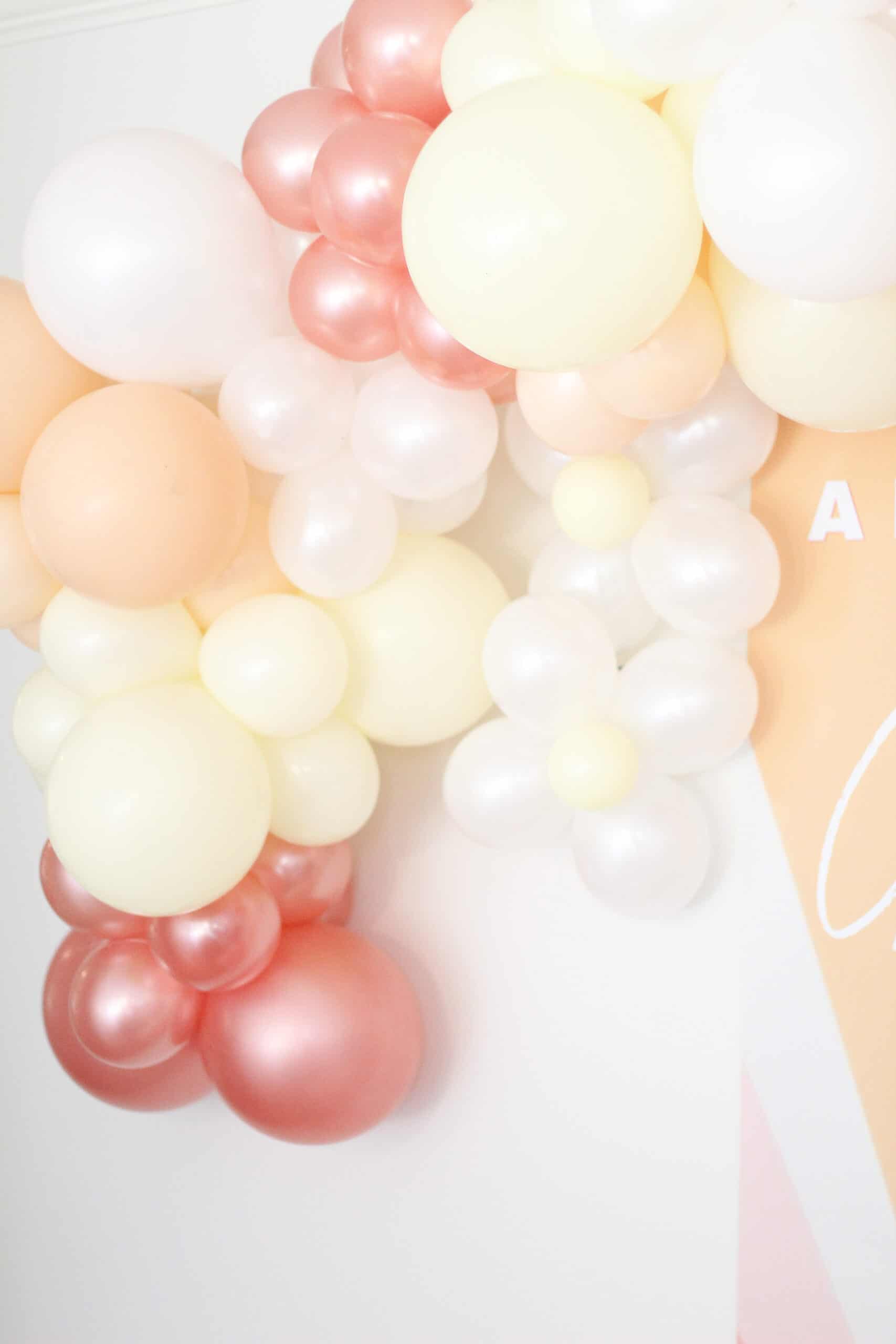 pink yellow and coral balloon garland 