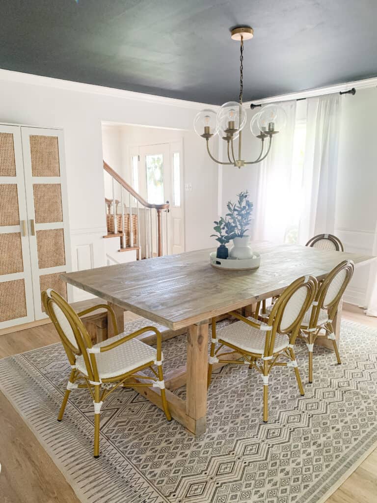 dining room with cane cabinet