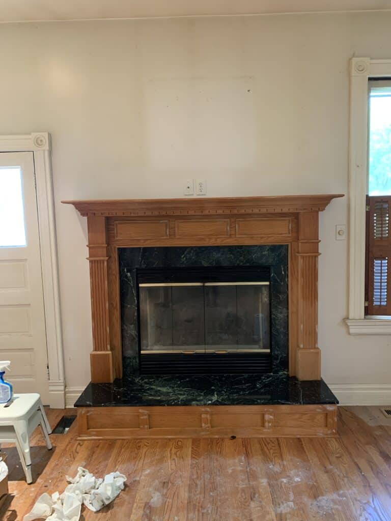 old wood fireplace with green marble