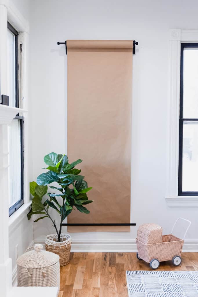 Easy DIY for hanging a roll of easel paper on the wall