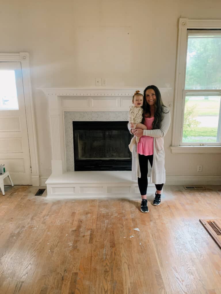 mom and baby by updated fireplace