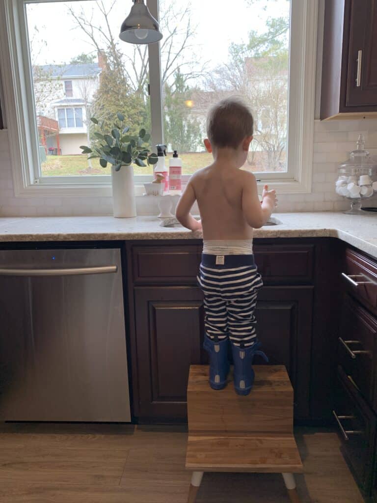 little boy washing hands