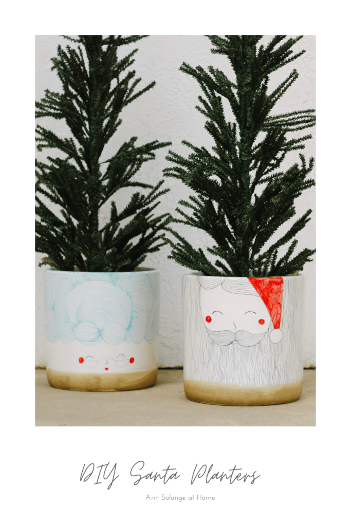 black and red Santa planters with sharpie 