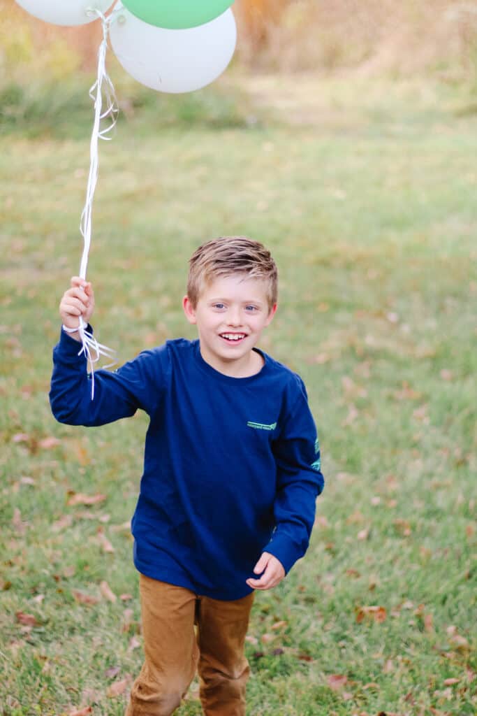 8 year old boy with balloons