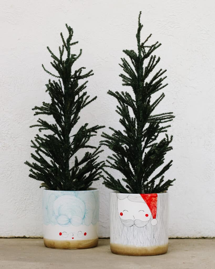 santa and mrs clause pots with faux Christmas trees