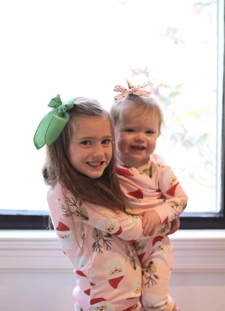 sisters in matching Christmas pajamas 