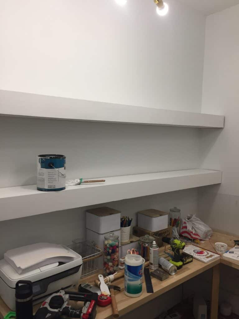 two long white floating shelves