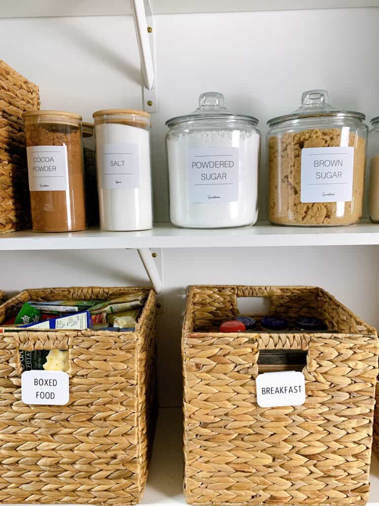 organized pantry with baskets and canisters