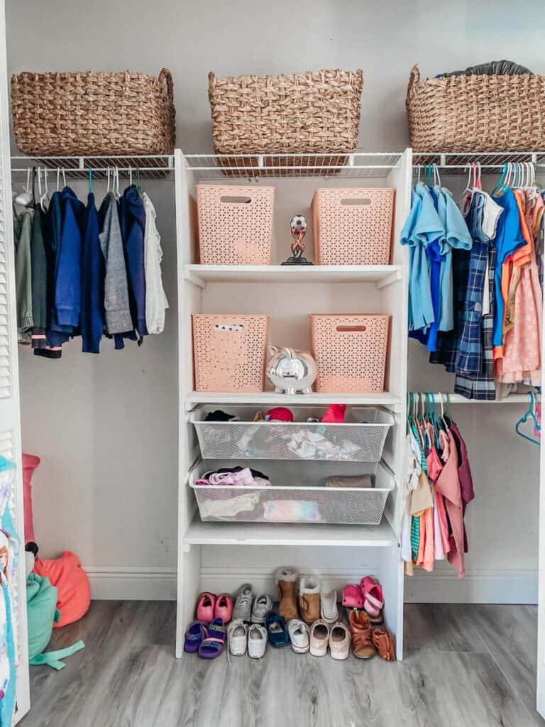 organized kids closet with baskets 