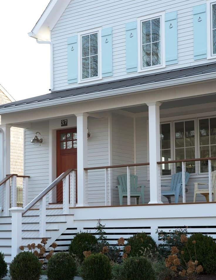 farmhouse with wire front porch railings