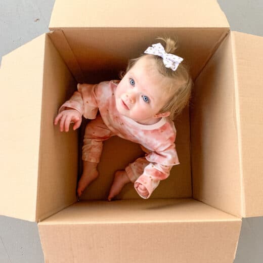 box with baby in it