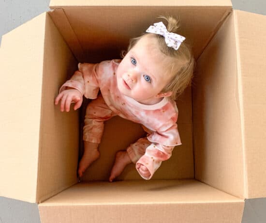 box with baby in it