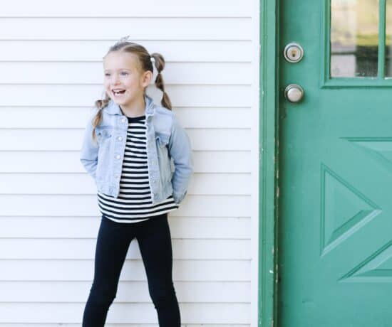 little girl by shed