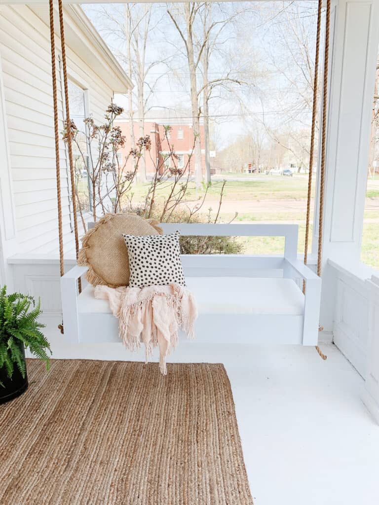 Diy porch swing on white front porch 