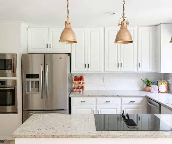 white kitchen with gold lights