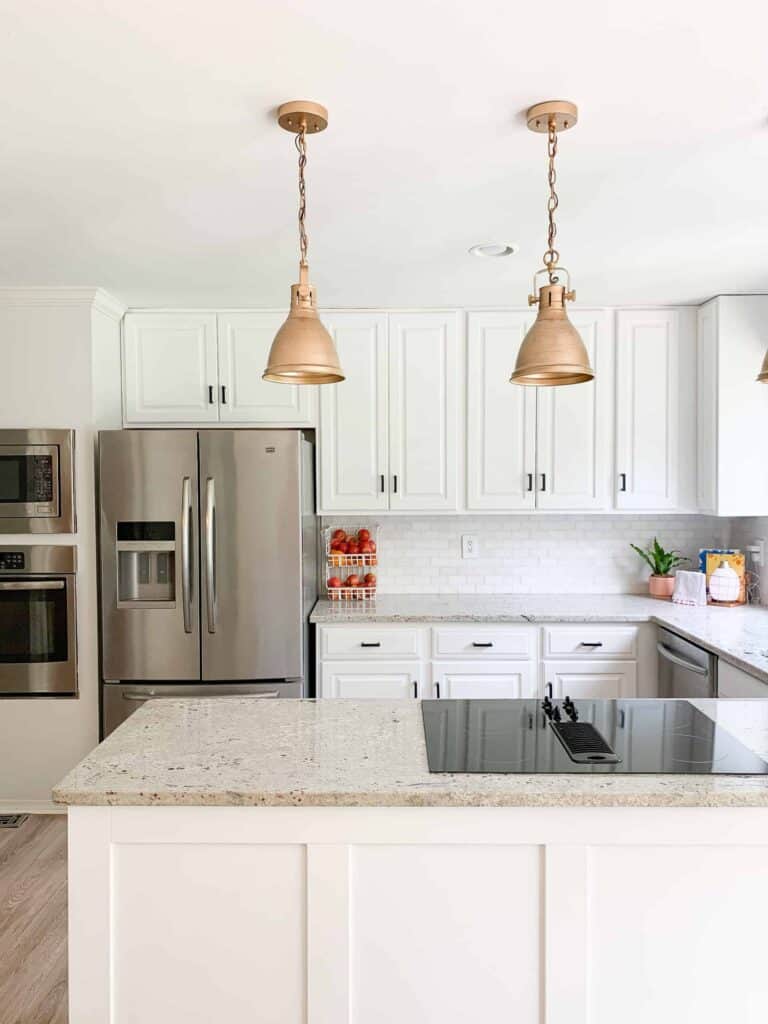 white kitchen with gold lights