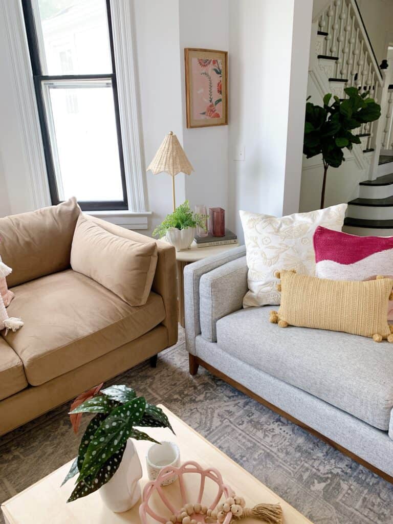 side table with brown and grey couches 