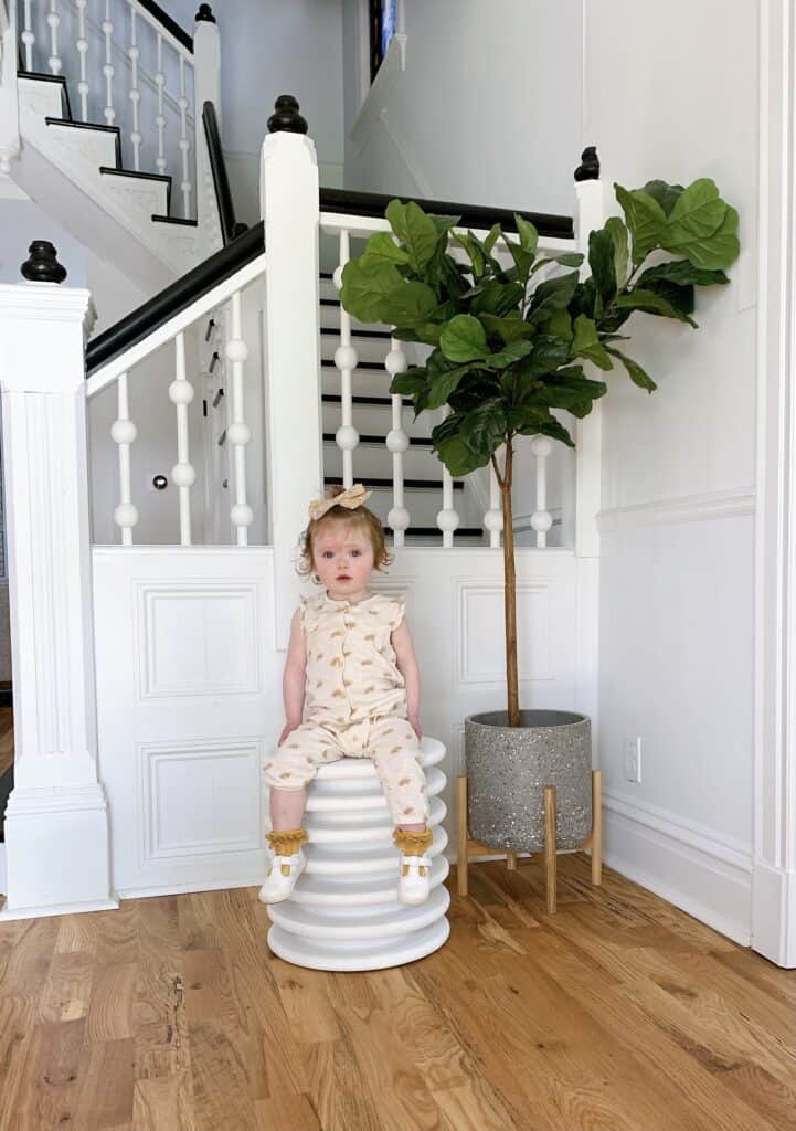 Toddler girl sitting on DIY Stool 