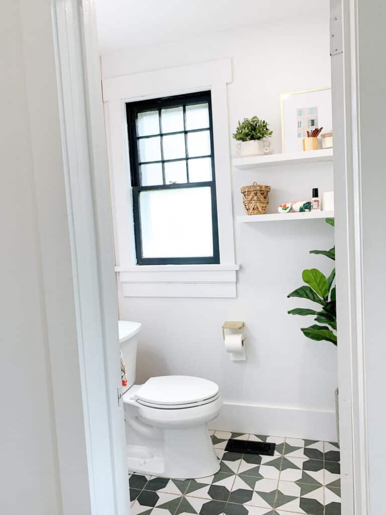 floating shelves and fiddle leaf fig in bathroom 