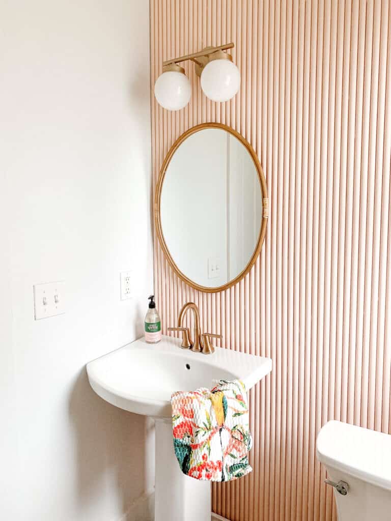 pink fluted wall with PVC pipe