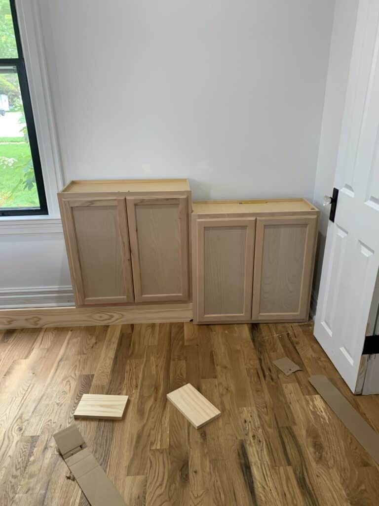 attaching stock cabinets to walls