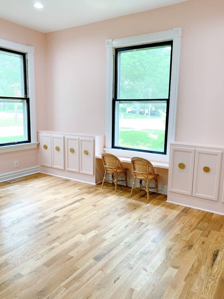 pink playroom with pink built in cabinets