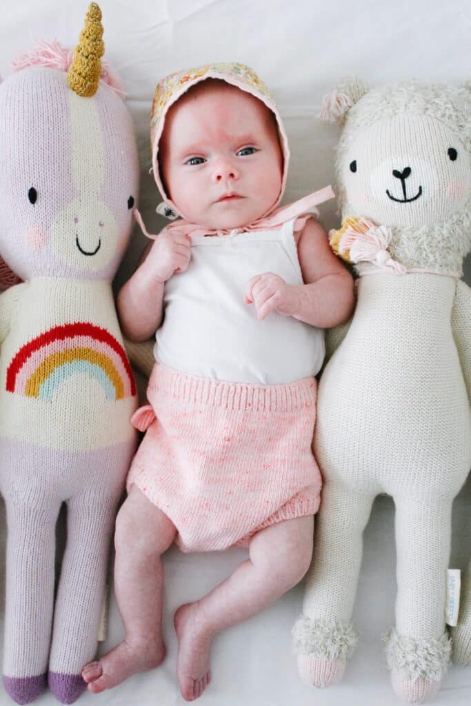 baby with cuddle and kind dolls