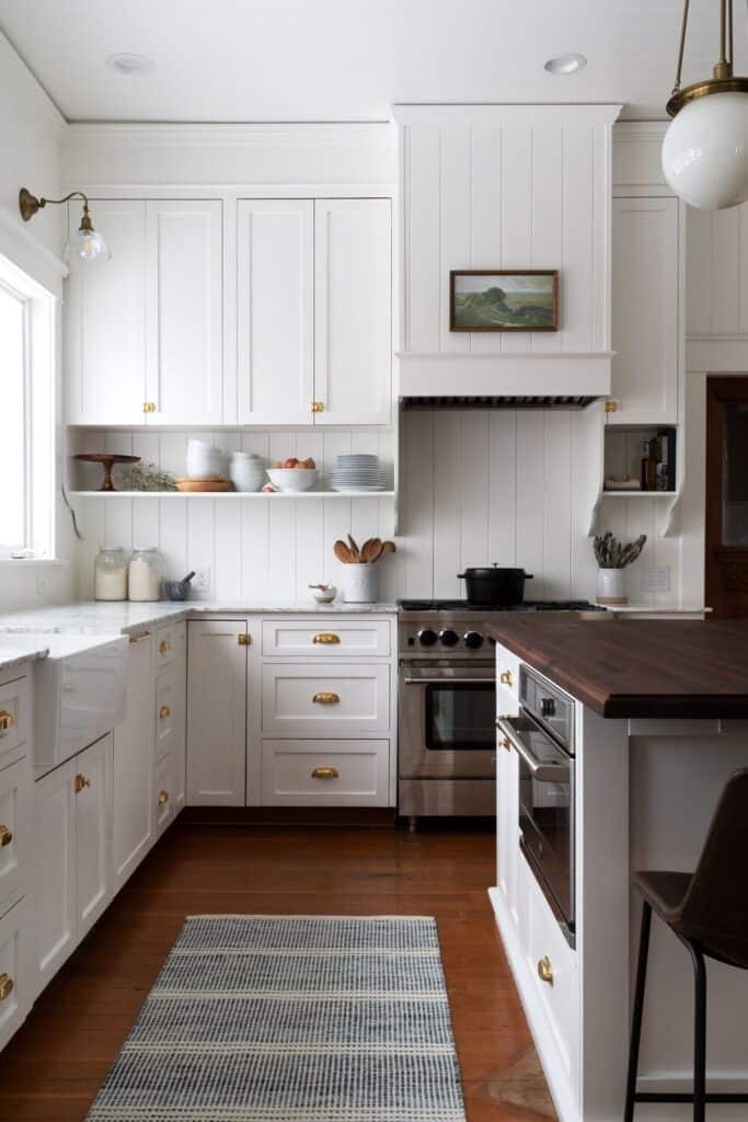 white kitchen cabinets with white backsplash 