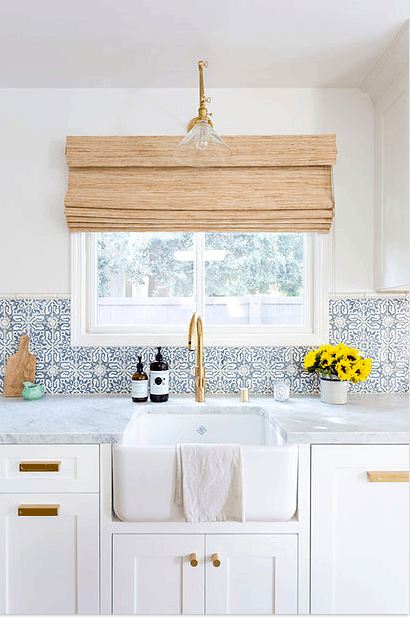 white kitchen with blue backsplash 