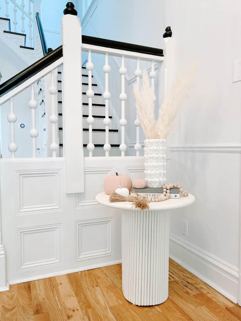 fluted end table and skull planter 