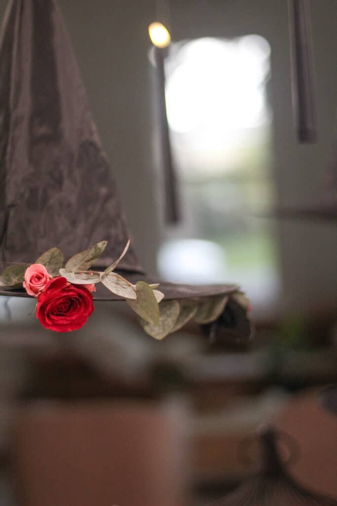 Hanging witch hats with flowers 