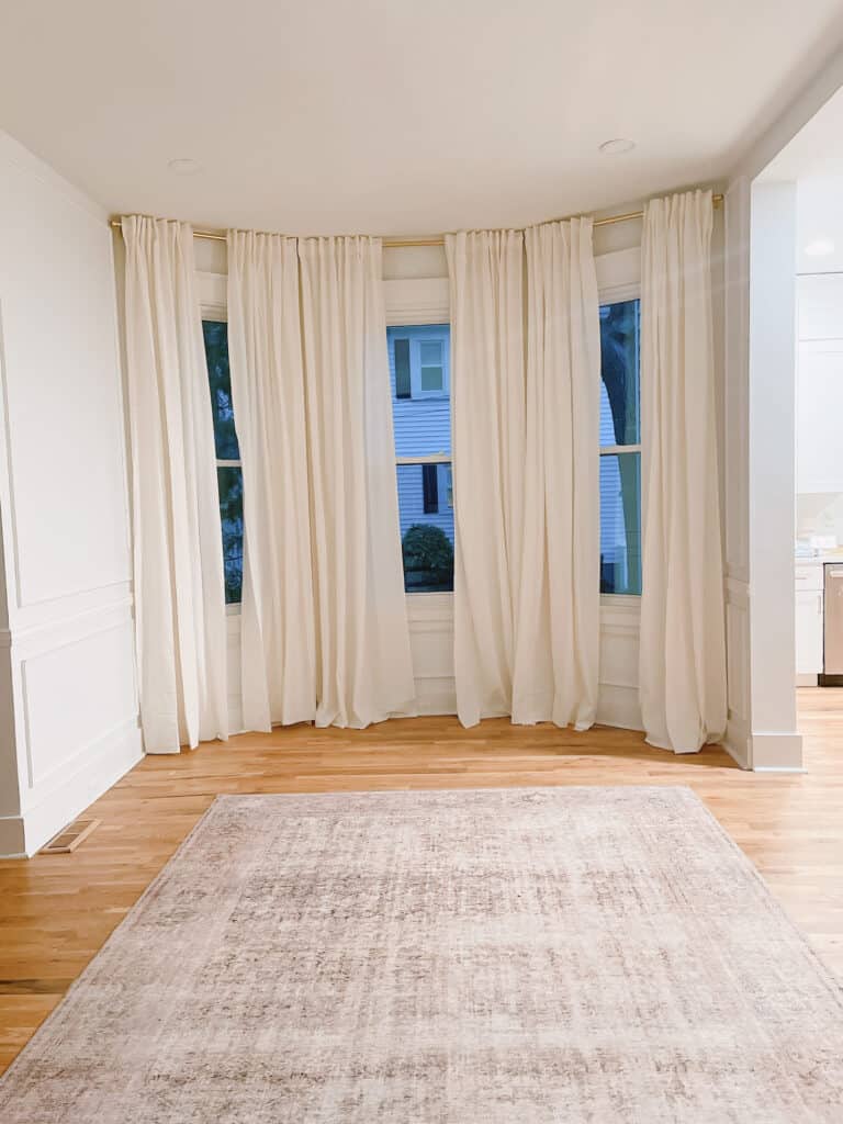Dining Room with Long White curtains 