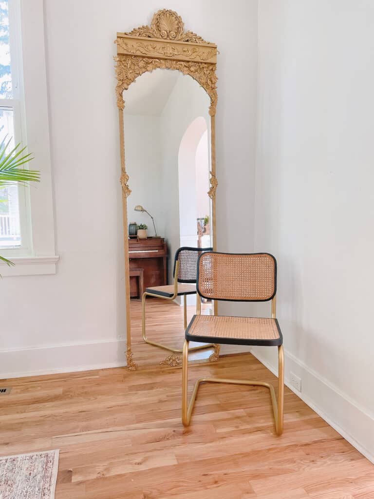vintage cane dining chair by gold mirror