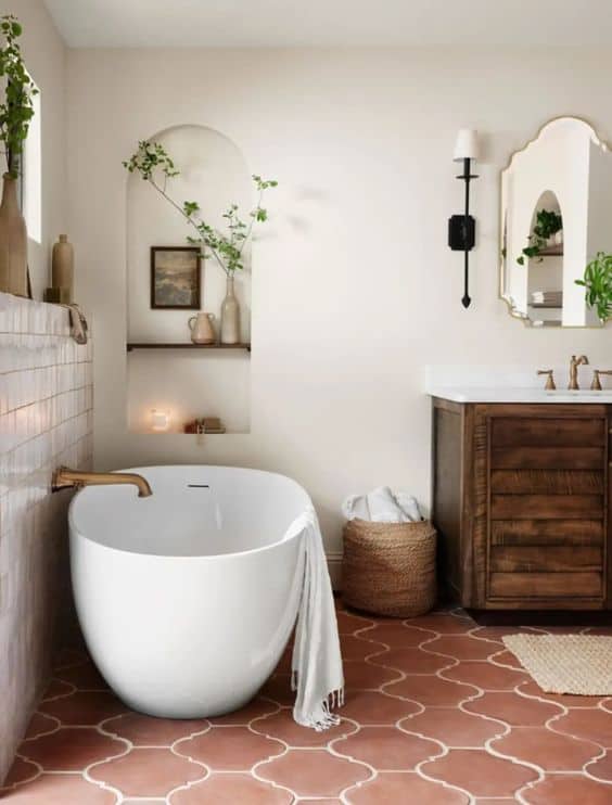 Modern fixtures meet Mediterranean design in primary bath