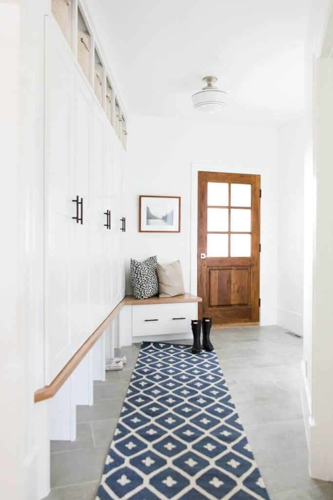 Neutral mudroom with wood tones