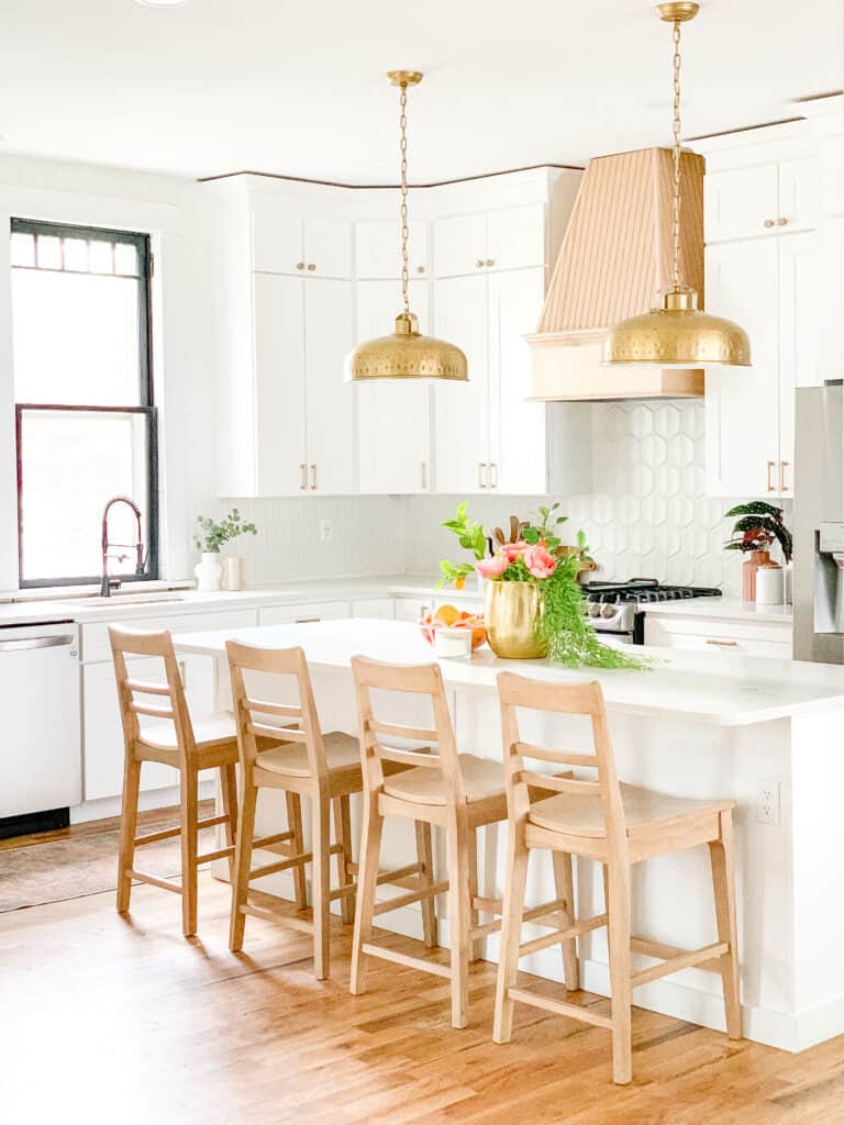 cozy white kitchen with pink hood