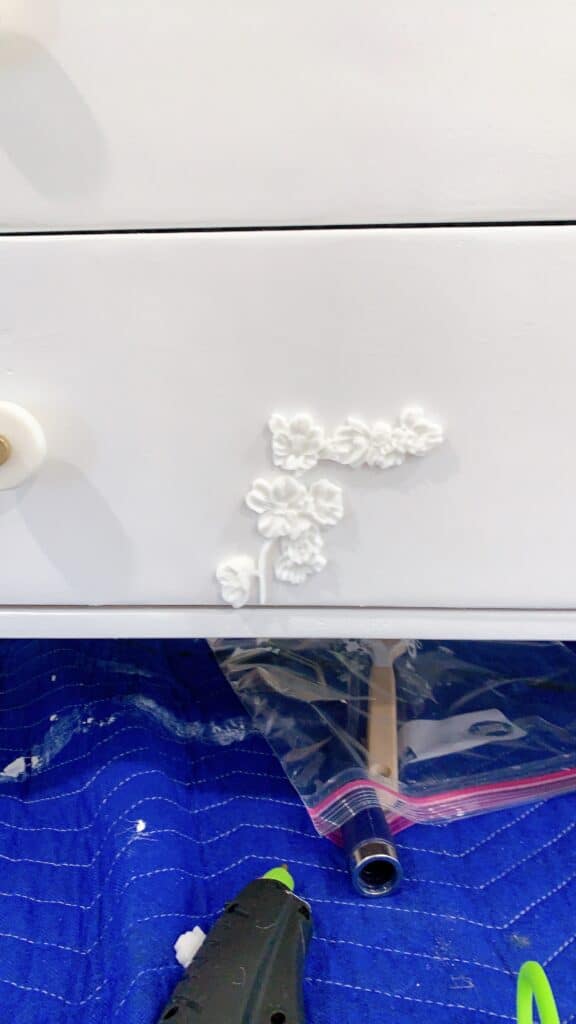 IKEA dresser with resin molds on it 