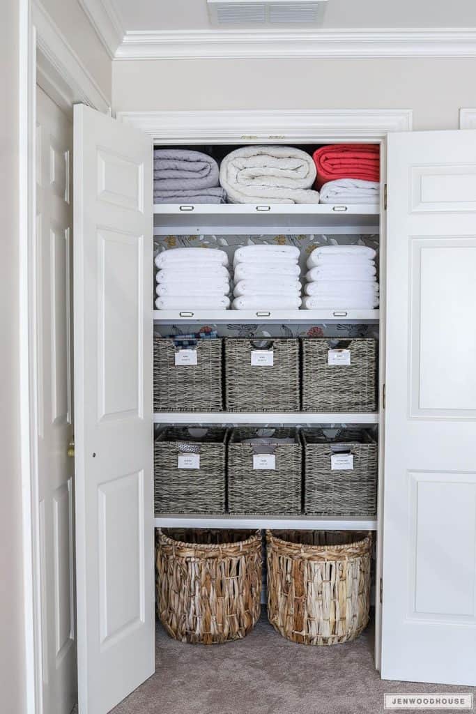 Linen Closet Organization with Baskets: A simple way to eliminate visual  clutter